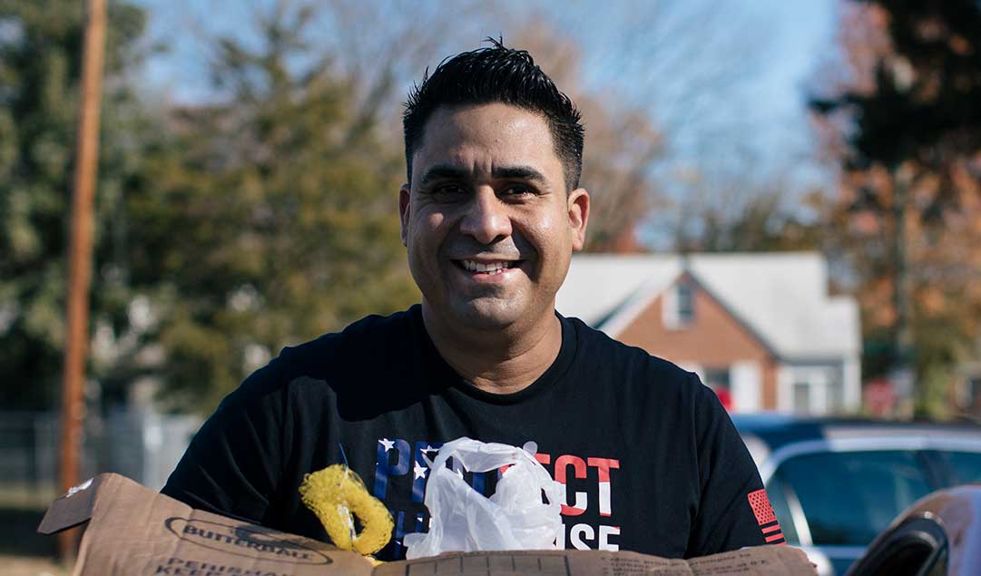 A man holding a box of groceries