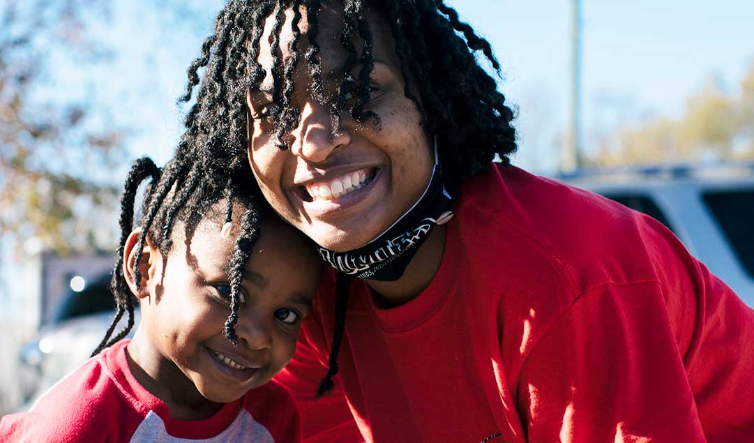 Two young sisters smiling