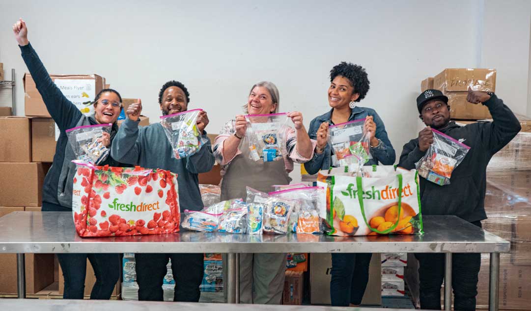 volunteers preparing snack bags