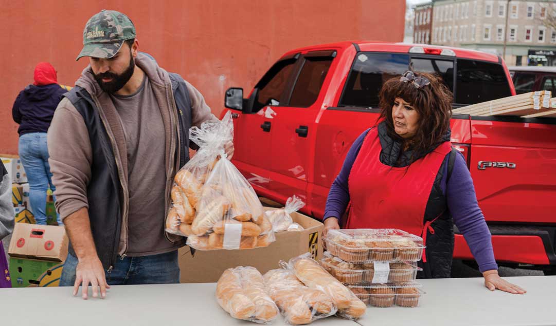 volunteers distributing bakery goods